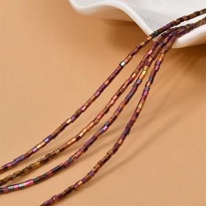 Macro shot of 2mm iridescent hematite column beads with metallic finish for DIY jewelry