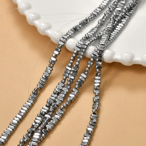 Macro shot of silver metallic hematite beads for DIY jewelry with high gloss finish