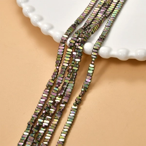Macro detail of iridescent plated rectangular hematite beads for DIY jewelry making