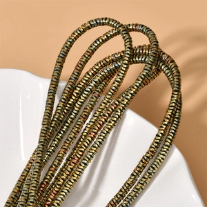 Macro shot of colorful metallic wave disk hematite beads for DIY handmade jewelry crafts