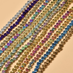 Macro detail of multi-color faceted 6mm heart beads for DIY jewelry and crafts
