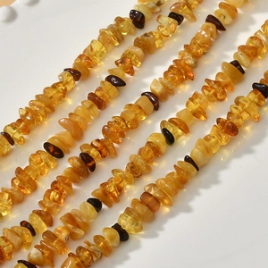 Macro detail of irregular polished amber resin beads for DIY jewelry making