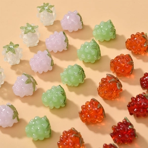 Detailed view of colorful berry-shaped glass beads for DIY jewelry making and crafts