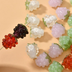 Macro shot of colorful glass raspberry beads for DIY bracelets and necklaces jewelry making