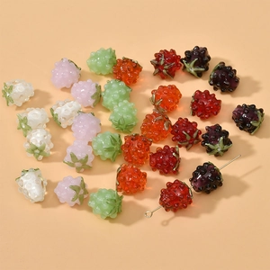 Macro view of colorful berry-shaped glass beads for DIY jewelry and necklaces