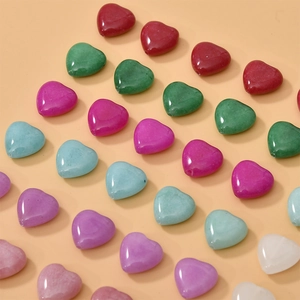 Close-up of heart-shaped colorful natural stone beads for DIY jewelry making accessories