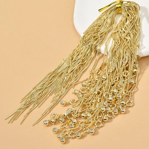 Detailed view of bundled gold-plated box chains with lobster clasps and bead charms