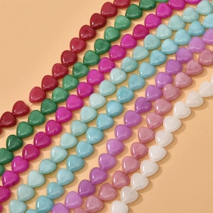 Close-up of colorful heart-shaped natural stone beads for DIY jewelry making
