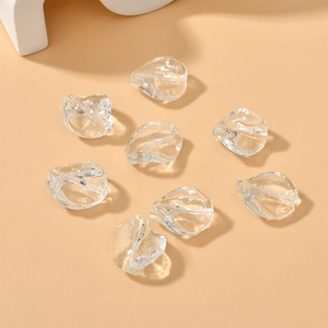 Detailed view of eight irregular twisted glass leaf beads for DIY jewelry making