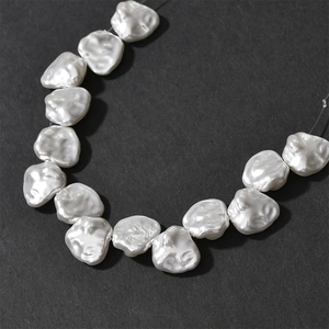 Baroque petal-shaped imitation shell pearls for DIY jewelry making on grey background