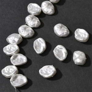 Macro detail of white baroque petal pearls with iridescent luster for DIY jewelry making