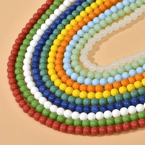 Macro shot of 8mm colorful round glass beads arranged in rows for jewelry making