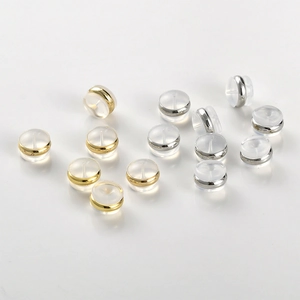 Detailed macro view of 18k gold and silver plated silicone earring backings for DIY jewelry