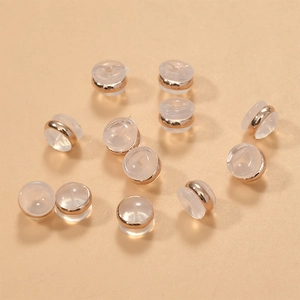 Detailed view of 18k gold plated silicone earring backs and earring stoppers for DIY making