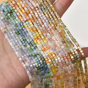 Close-up of 2mm colorful sugar-cube faceted crystal glass beads for DIY jewelry making