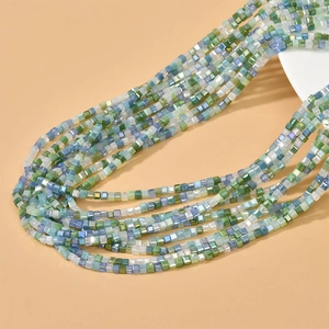 Detail of 2mm faceted crystal cube beads in mint and blue tones for DIY jewelry