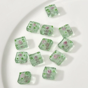 Translucent green glass square flower beads for handmade jewelry crafts and DIY designs