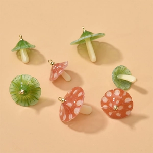Cute mushroom acrylic charms in green and orange for DIY jewelry making and crafts