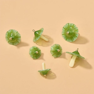 Green and white acrylic mushroom charms with gold loops for DIY jewelry making