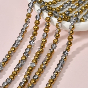 Detail of 8mm electroplated gold beads and crackle glass beads for DIY jewelry