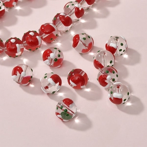 DIY glass beads with festive Christmas hat patterns and green dots for jewelry making