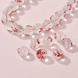 Close-up of red and white polka dot heart glass beads for DIY jewelry making