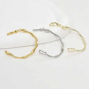 Irregular organic wavy bangles in high-polished gold and silver liquid metal finish
