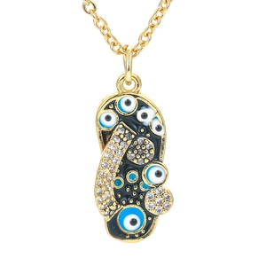 Gouden slippers ketting met zwart emaille boze oog hanger en glinsterende kristallen