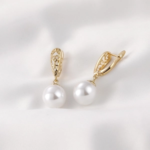 Vintage 18k vergulde holle waterdruppel oorbellen met witte parels op witte zijde