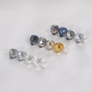 Macro detail of faceted AB coating crystal heart and teardrop beads for jewelry making