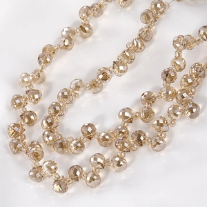 Macro shot of champagne gold faceted crystal teardrop beads for jewelry making