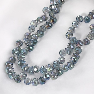 Macro view of faceted iridescent grey-blue crystal beads for DIY jewelry making