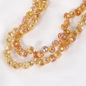 Macro shot of faceted iridescent amber glass beads for DIY jewelry and necklaces