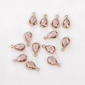 Set of 11 faceted champagne pink teardrop glass pendants with gold-plated metal frames