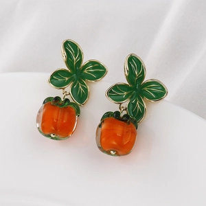 Handmade persimmon glass pendant earrings with green leaves and gold plated metal trim