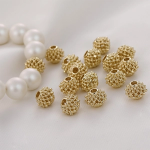 Detailed view of 14K gold-filled hollow lantern beads for DIY handmade jewelry crafts