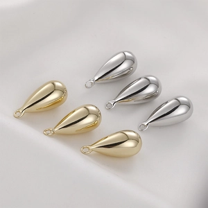 5pcs gold and silver teardrop jewelry charms set on white silk for DIY earring making