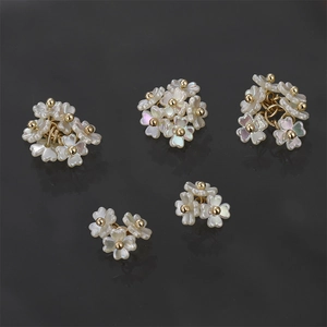 Five-piece set of white faux shell flower charms with gold centers for DIY jewelry