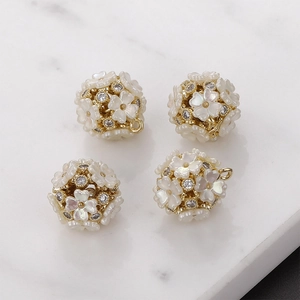 Set of four 14k gold plated French shell flower pendants with crystal zircons