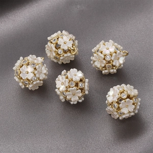 Five 14k gold-plated hollow flower ball pendants with white shells and zircon accents