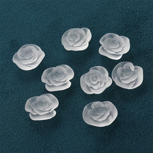 Detailed close-up of matte translucent frosted resin rose flower buds for DIY jewelry