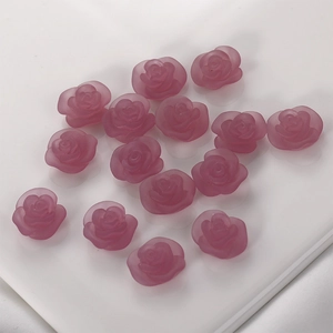 Flat lay view of 14 matte purple resin rose buds for DIY jewelry and hair accessories