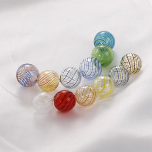 Macro shot of colorful spiral textured glass beads for DIY jewelry making and necklaces