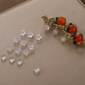Various soft silicone earring backs set with star and flower shapes for secure fit