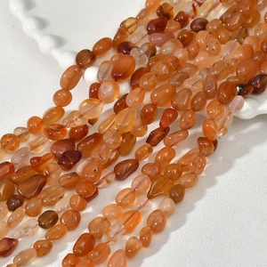 Close-up of polished irregular carnelian gemstone beads for DIY jewelry making