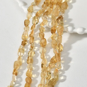 Close-up of irregular 5-8mm yellow crystal quartz beads for DIY jewelry making