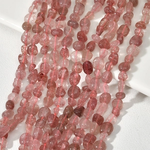 Close-up of irregular pink strawberry quartz beads for DIY jewelry and accessories