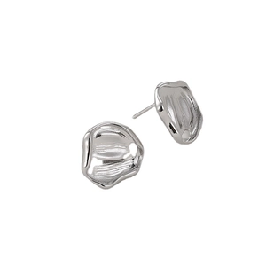Minimalist silver irregular wrinkled earrings with modern metallic texture on white background