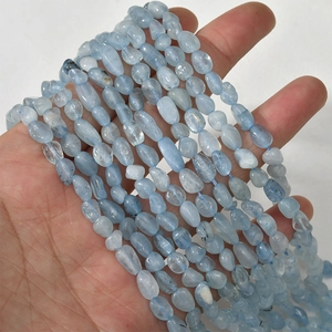 Macro view of irregular light blue natural crystal chip beads for DIY jewelry making