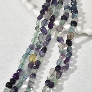 Macro shot of 5-8mm multi-color natural fluorite irregular beads for DIY jewelry